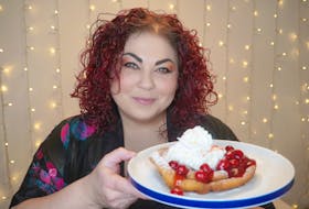 Chef Ilona Daniel displays the cherry-slathered funnel cake she whipped up using a box of store-bought complete pancake mix. Contributed photo