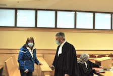 Neila Blanchard of Parson’s Pond talks with her lawyer, Jamie Luscombe, in the Supreme Court of Newfoundland and Labrador in Corner Brook on Monday, May 2, 2022.
