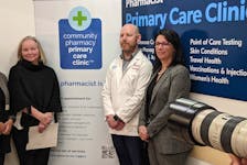 Allison Bodnar, executive director of the Pharmacy Association of Nova Scotia, Dartmouth pharmacist Alvin Thompkins and Health Minister Michelle Thompson pose for photos after a news conference Tuesday at Thompkins' pharmacy.