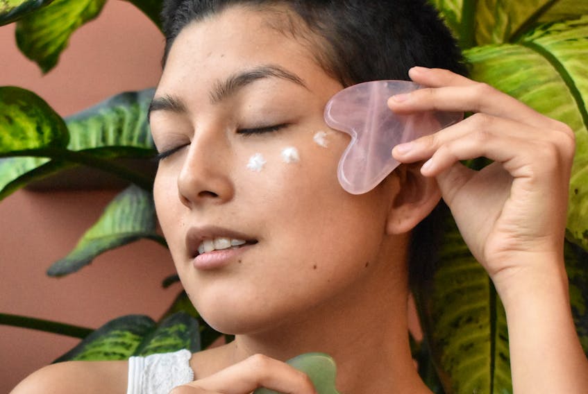 A gua sha stone can help brighten, lift and tone the skin. Lymphatic drainage can be done with the stone as well. Cherrydeck photo/Unsplash