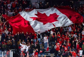 Fans pass a massive Canadian flag around the Scotiabank Centre in Halifax before the IIHF world junior championship quarter-final between Canada and Slovakia on Monday. See C1 for a recap of the game and a preview of Wednesday's semifinal between Canada and the United States.
Ryan Taplin - The Chronicle Herald