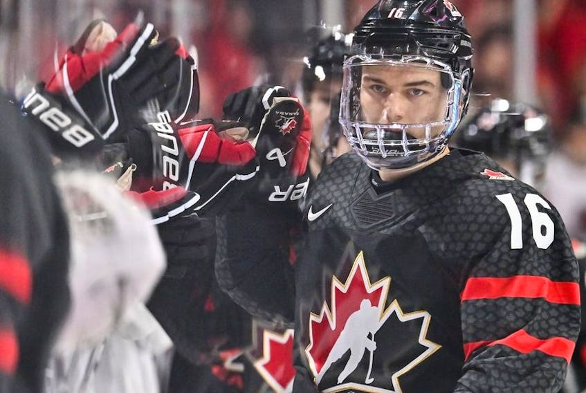 Connor Bedard of Team Canada celebrates his goal with teammates on the bench during the first period against Team Slovakia in the quarterfinals of the 2023 IIHF World Junior Championship at Scotiabank Centre on January 2, 2023 in Halifax, Nova Scotia, Canada.