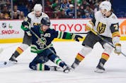  Canucks star Elias Pettersson, going down to block a shot from Vegas Golden Knight William Karlsson (right), leads Vancouver forwards with blocked shots so far this season.