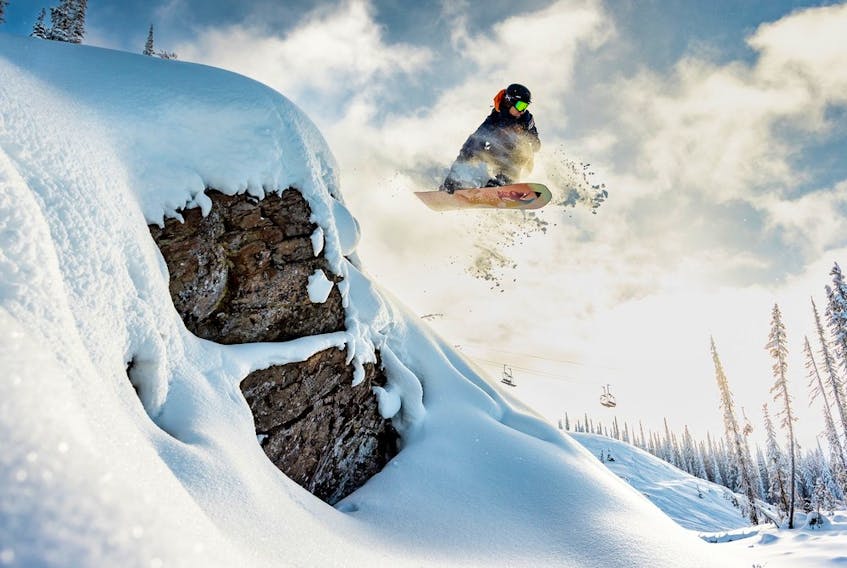  A snowboarder gets some air at Revelstoke Mountain Resort