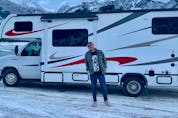  Postmedia reporter Daniel Austin poses in front of a motorhome he took on a recent trip to Revelstoke Mountain Resort and Sun Peaks Resort.