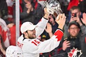 Canadian team captain Shane Wright skates with the IIHF world junior hockey championship trophy after Thursday's overtime win against the Czech Republic in Halifax.
