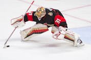  Senators goalie Anton Forsberg settles the puck in the third period of last Sunday’s game against the visiting Buffalo Sabres.