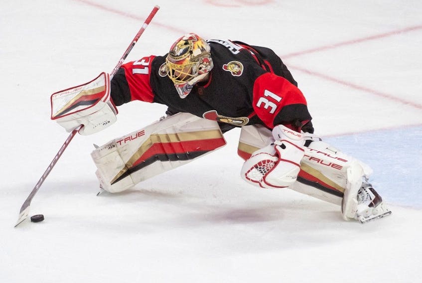  Senators goalie Anton Forsberg settles the puck in the third period of last Sunday’s game against the visiting Buffalo Sabres.
