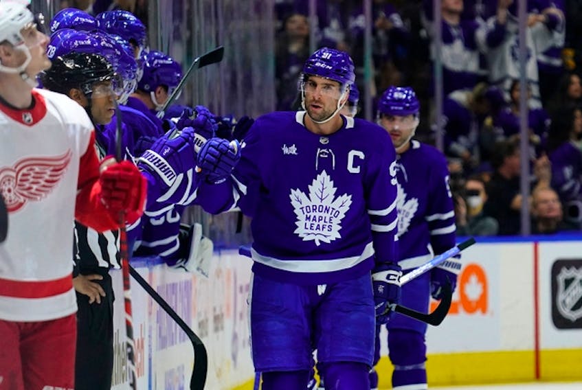 Maple Leafs forward John Tavares is congratulated after scoring against the Detroit Red Wings during the second period at Scotiabank Arena on Saturday night. Tavares added an empty-netter in the third period.