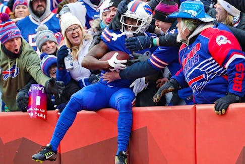 John Brown of the Buffalo Bills celebrates with fans after catching a touchdown pass during the third quarter against the New England Patriots at Highmark Stadium on Jan. 8, 2023 in Orchard Park, N.Y.