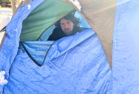 Kale, 30, is shown in the tent that he's been living in for more than a week at Point Pleasant Park in Halifax.