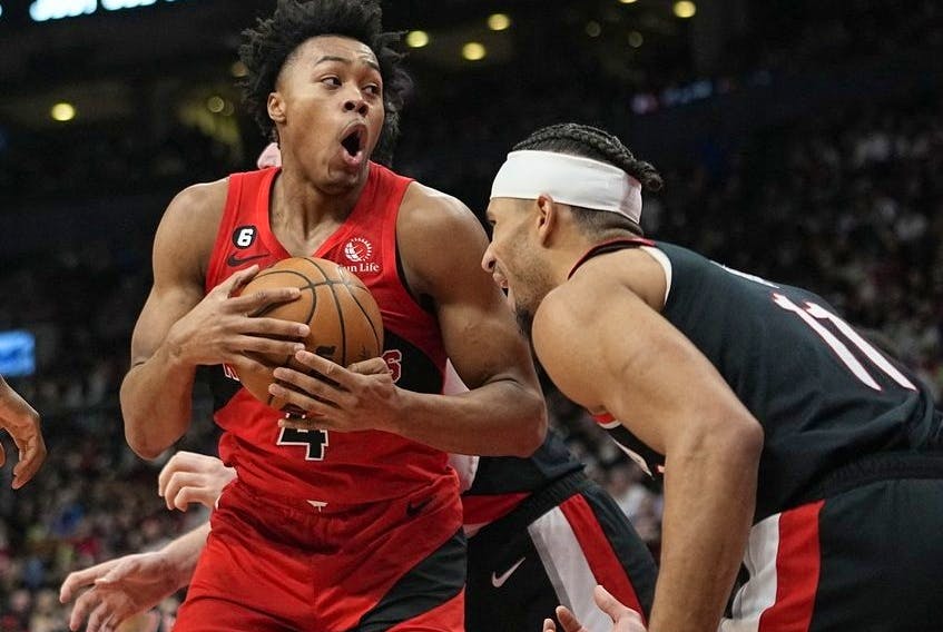 Toronto Raptors forward Scottie Barnes comes down with a rebound against Portland Trail Blazers guard Josh Hart during the second half at Scotiabank Arena. 