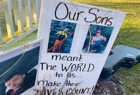 A poster with photographs of Colton Cook, murdered in September 2020, and Zack Lefave, missing since Jan. 1, 2021, was included at a gathering in Frost Park in Yarmouth on Jan. 8 to remember the two young men and to show support to their families. TINA COMEAU