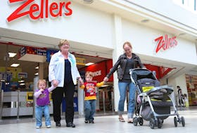 Shoppers walk past the Zellers store at the Woodbine Centre in Etobicoke on May 26, 2011.