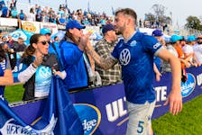 HFX Wanderers defender Cale Loughrey celebrates Saturday with fans at the Wanderers Grounds after his team beat Forge FC 2-1 to clinch a playoff berth. - Canadian Premier League