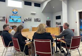 Doug DeBarres (right) addresses Pictou council on Oct. 3. He feels like the town overstepped by not consulting with hospitality and accommodations operators before going ahead with the bylaw. ANGELA CAPOBIANCO
