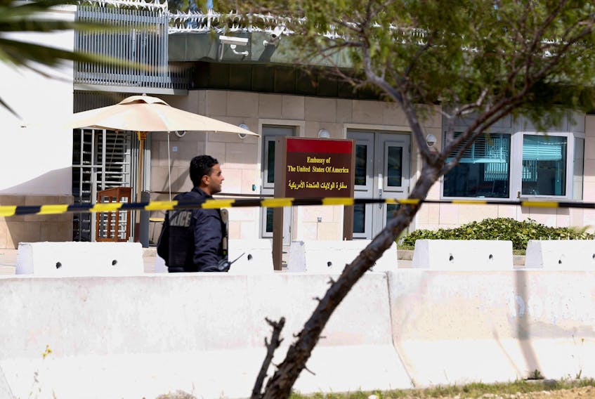 FILE PHOTO: A police officer walks outside the U.S. embassy after a suicide attack in Tunis, Tunisia March 6, 2020. REUTERS/Zoubeir Souissi/File Photo