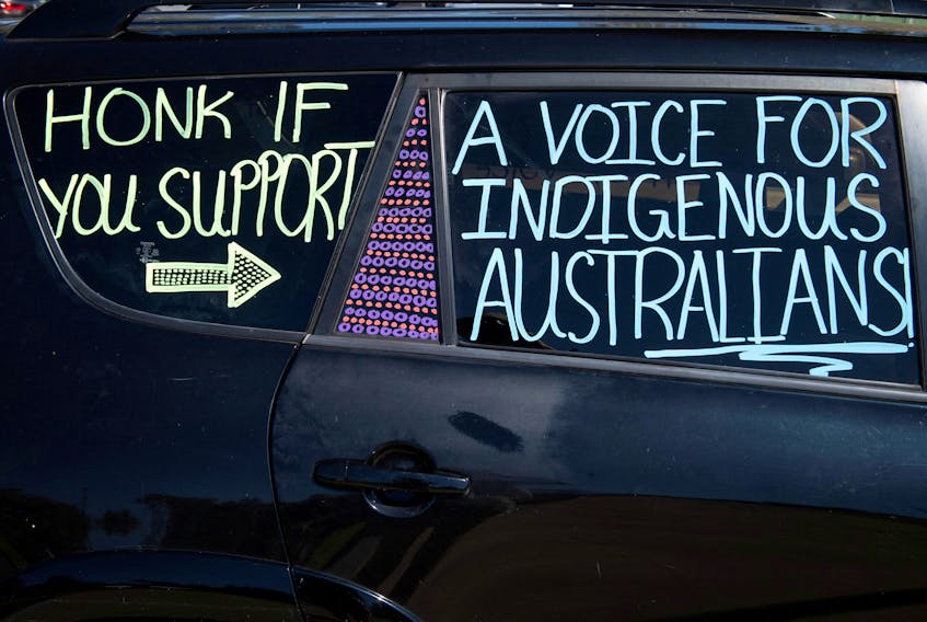 FILE PHOTO: Writing on a car displays support for the 'Yes' vote in Australia's upcoming referendum on Indigenous issues, at a car park in Alice Springs, Australia, September 17, 2023.  REUTERS/Jaimi Joy/File Photo