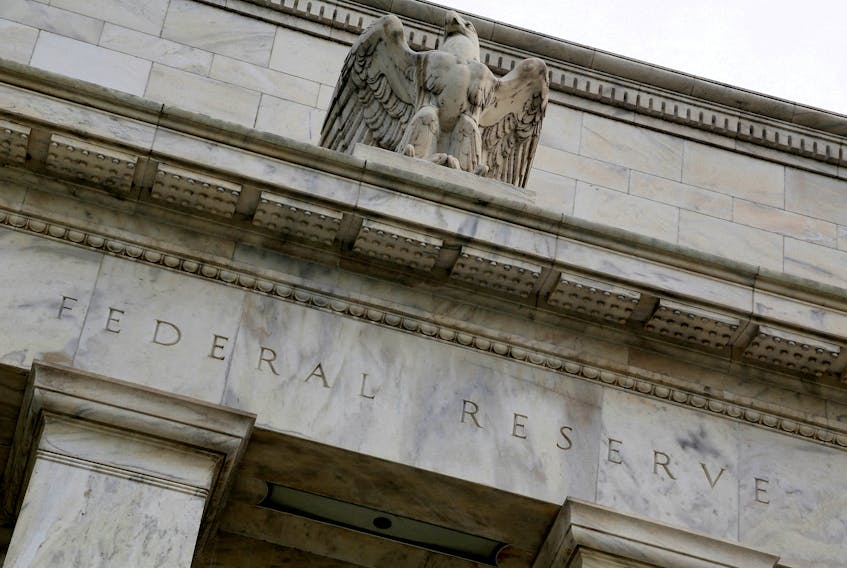 FILE PHOTO: An eagle tops the U.S. Federal Reserve building's facade in Washington, July 31, 2013. REUTERS/Jonathan Ernst/File Photo