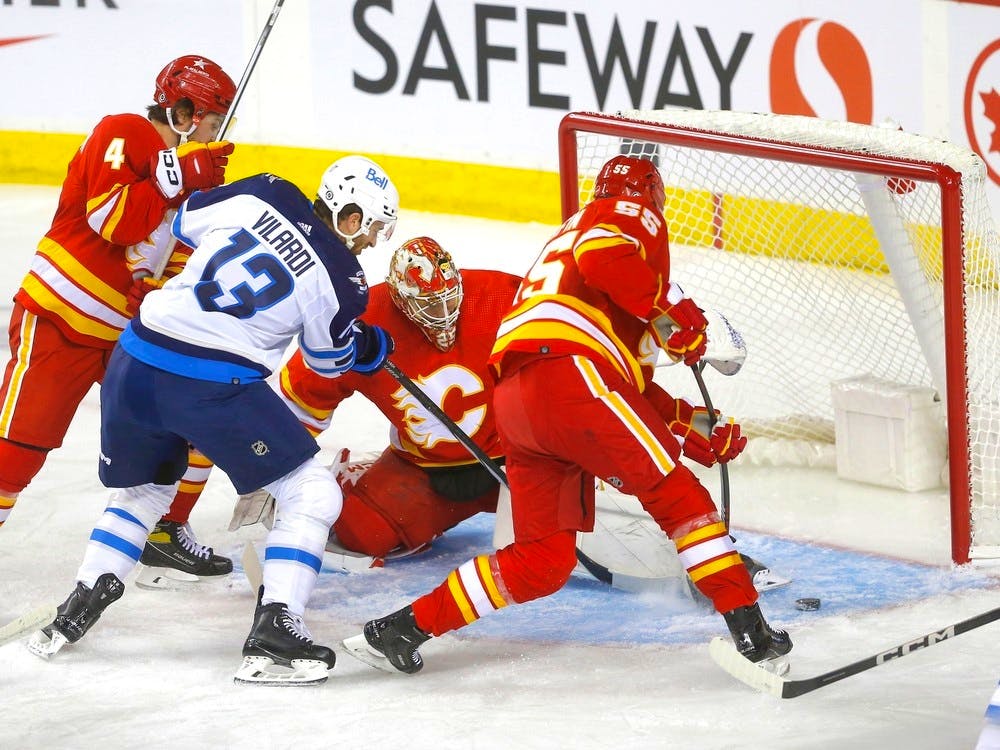 Andrew Mangiapane has 2 goals and an assist, Flames beat Jets 5-3 in opener, National Sports