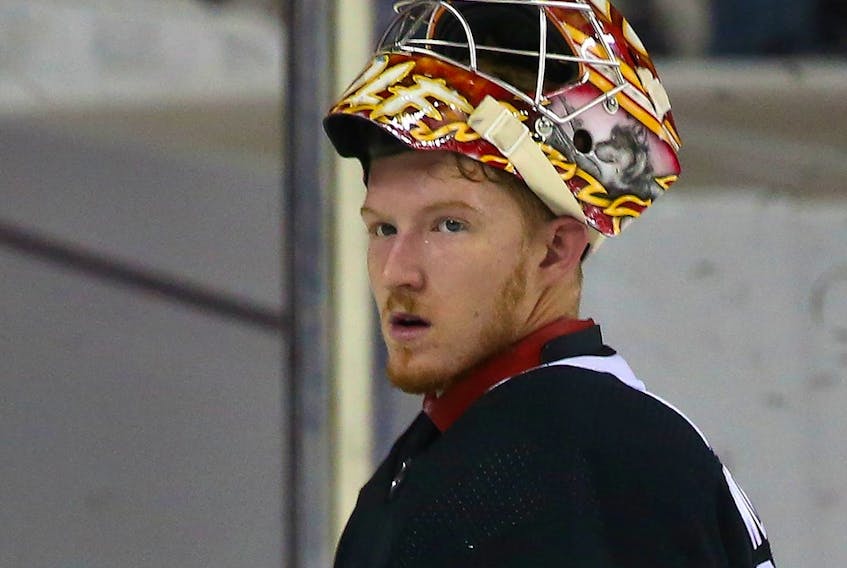 Dustin Wolf has embraced the competition among the goaltenders at Flames training camp.