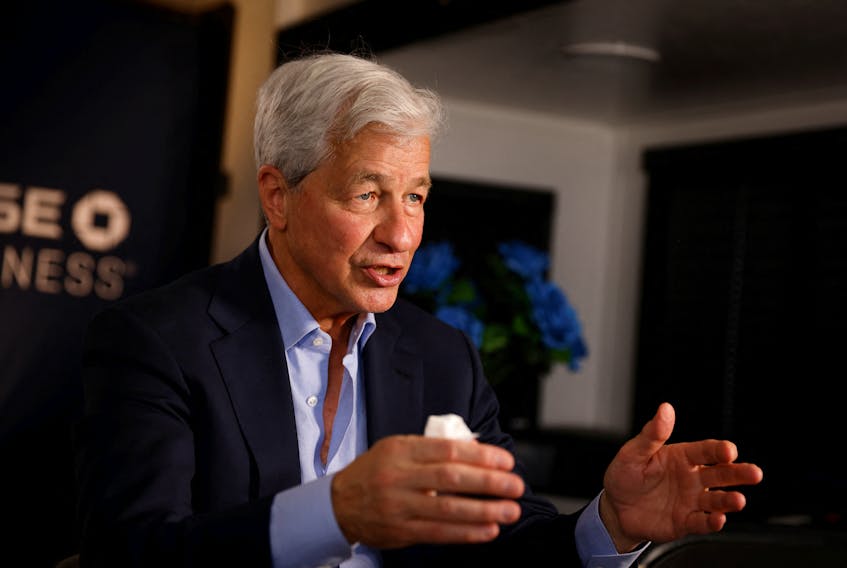 FILE PHOTO: Jamie Dimon, Chairman of the Board and Chief Executive Officer of JPMorgan Chase & Co., gestures as he speaks during an interview with Reuters in Miami, Florida, U.S., February 8, 2023. REUTERS/Marco Bello/File Photo