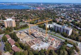 Cranes rise above a large Dunbrack Street apartment construction project in Halifax on Sept. 26, 2023, - Tim Krochak
