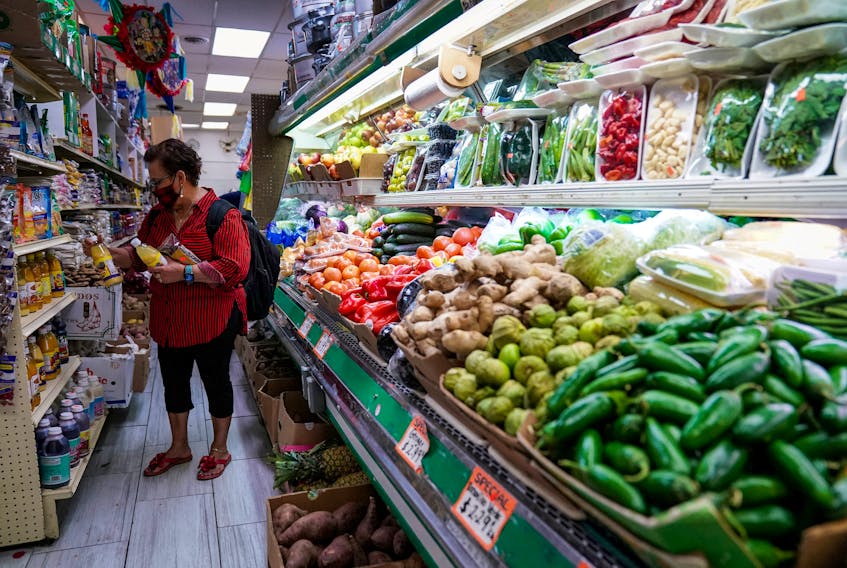 FILE PHOTO: A woman shops for groceries at El Progreso Market in the Mount Pleasant neighborhood of Washington, D.C., U.S., August 19, 2022. REUTERS/Sarah Silbiger/File Photo/File Photo