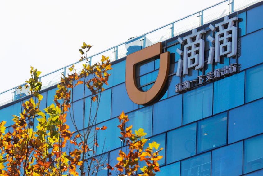 FILE PHOTO: A Didi logo is seen at the headquarters of Didi Chuxing in Beijing, China November 20, 2020. REUTERS/Florence Lo/File photo