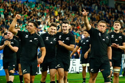 Rugby Union - Rugby World Cup 2023 - Quarter Final - Ireland v New Zealand - Stade de France, Saint-Denis, France - October 14, 2023 New Zealand's Beauden Barrett and Will Jordan celebrate with teammates after the match REUTERS/Sarah Meyssonnier