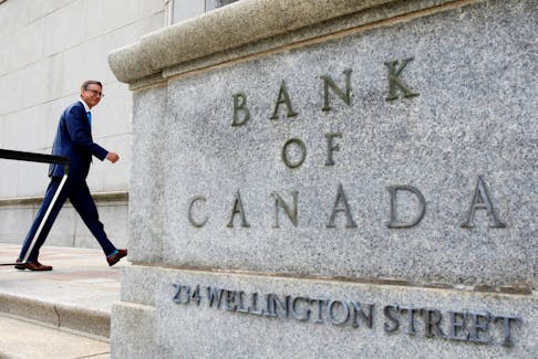 FILE PHOTO: Governor of the Bank of Canada Tiff Macklem walks outside the Bank of Canada building in Ottawa, Ontario, Canada June 22, 2020. REUTERS/Blair Gable/File Photo