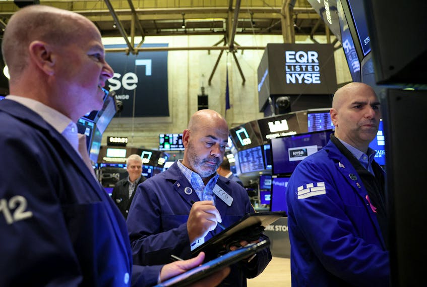 FILE PHOTO: Traders work on the floor of the New York Stock Exchange (NYSE) in New York City, U.S., September 28, 2023.  REUTERS/Brendan McDermid/File Photo