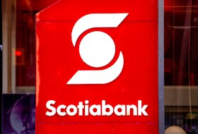 A sign for The Bank of Nova Scotia, operating as Scotiabank, in Toronto, Ontario, Canada, Dec. 13, 2021.