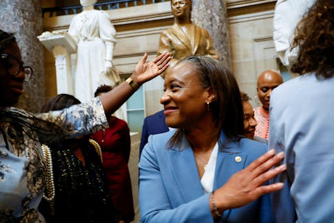 U.S. Senator Laphonza Butler (D-CA) is congratulated by new colleagues from the Congressional Black Caucus after being sworn in as the newest member of the caucus in front of the statue of civil rights leader Rosa Parks in Statuary Hall, shortly after Butler was sworn in to fill the U.S. Senate vacancy caused by the recent death of U.S. Senator Dianne Feinstein (D-CA), at the Capitol in Washington, U.S., October 3, 2023.