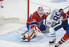 Toronto Maple Leafs' Nicholas Robertson (89) scores against Montreal Canadiens goaltender Samuel Montembeault as  William Trudeau defends.