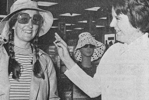 Barbara Hughes, of Windsor, tried out a new pair of sunglasses at the Met’s new store at the Fort Edward Mall in 1973. She was aided by Lynn Tilley.