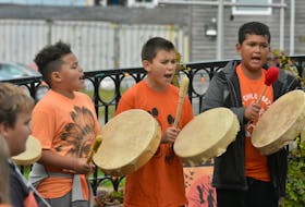 Children from the Wasoqopa’q First Nation, formerly known as the Acadia First Nation, perform the Mi'kmaq Honour Song during a Truth and Reconciliation event involving school students held in Yarmouth's Frost Park on Sept. 29. TINA COMEAU PHOTO