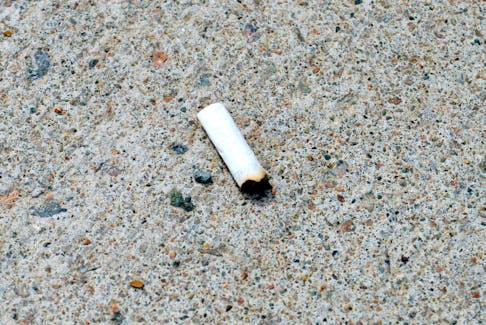 A cigarette butt is seen on a downtown Sydney sidewalk. The Sydney Downtown Development Association recently purchased 22 cigarette butt receptacles that will be mounted outside bars, restaurants, bus stops and other locations. Chris Connors/Cape Breton Post