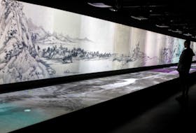 BEIJING (Reuters) - The Chinese military released an animated short film on National Day showing pieces of a scroll painting torn in two more than 300 years ago being reunited, in a show of the
