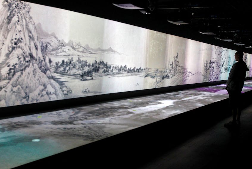 BEIJING (Reuters) - The Chinese military released an animated short film on National Day showing pieces of a scroll painting torn in two more than 300 years ago being reunited, in a show of the