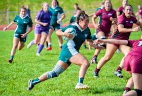 Ria Johnston carries the ball for the UPEI Panthers in an Atlantic University Sport Women’s Rugby Conference game against the Saint Mary’s Huskies at MacAdam Field in Charlottetown on Oct. 1. Johnston scored three trys in the Panthers’ 56-19 win. Janessa Vanden Broek/UPEI Athletics • Special to The Guardian