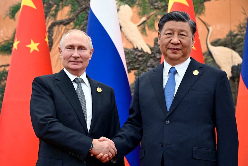 Russian President Vladimir Putin shakes hands with Chinese President Xi Jinping during a meeting at the Belt and Road Forum in Beijing, China, October 18, 2023. Sputnik/Sergei Guneev/Pool via REUTERS /File Photo