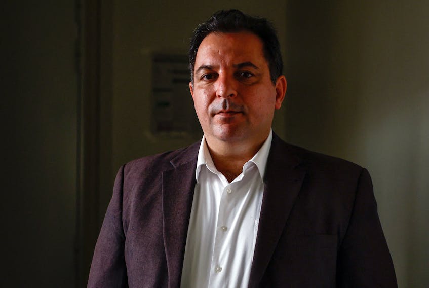 Mazen Darwish, head of the Syrian Center for Media and Freedom of Expression poses after an interview with Reuters in Paris, France, September 15, 2023.
