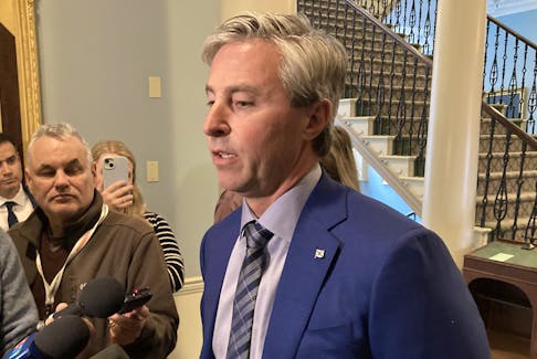 Premier Tim Houston, speaking to reporters at the Nova Scotia legislature on Wednesday, Oct. 18, 2023,  says the government has to look at spending capacities when dealing with programs like the heating assistance rebate. - Francis Campbell