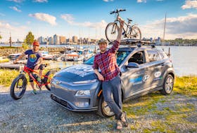 Jan LaPierre, left, and Chris Surette, co-founders of A for Adventure, show off the Hyundai Kona EV while stopped at the Dartmouth waterfront.  The company uses the Kona EV, which is supplied by Steele Auto Group, to travel across Atlantic Canada in search of outdoor adventures, and to shoot videos on behalf of numerous clients. - Adam Cornick