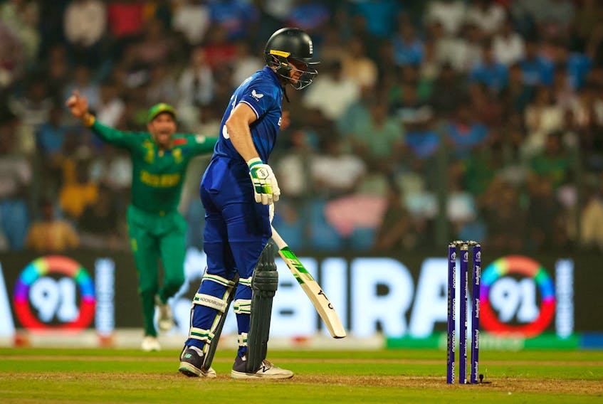 Cricket - ICC Cricket World Cup 2023 - England v South Africa - Wankhede Stadium, Mumbai, India - October 21, 2023 England's Jos Buttler reacts after losing his wicket