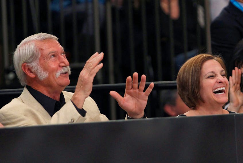 Olympic Gold medallist gymnast Mary Lou Retton (R) of the U.S. and her former coach Bela Karolyi laugh as they sit next to the floor during the AT&T American Cup gymnastics competition at New York's Madison Square Garden March 3, 2012.