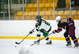 UPEI Panthers forward Chloe McCabe, 6, looks to protect the puck from the Saint Mary’s Huskies’ Keyara Nelson, 16, during an Atlantic University Sport (AUS) Women’s Hockey Conference game at MacLauchlan Arena in Charlottetown on Oct. 22. The Huskies won the game 2-0. Janessa Vanden Broek/UPEI Athletics • Special to The Guardian