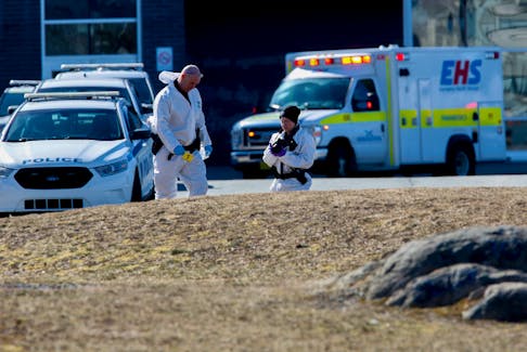 Members of the Halifax Regional Police forensics identification unit are seen in front of C.P. Allen High School after a stabbing incident at the school in Bedford March 20, 2023. 

TIM KROCHAK PHOTO