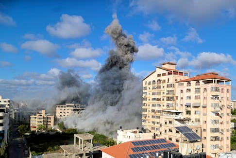 Smoke rises following an Israeli air strike, amid a flare-up of Israeli-Palestinian fighting, in Gaza City May 17, 2021.